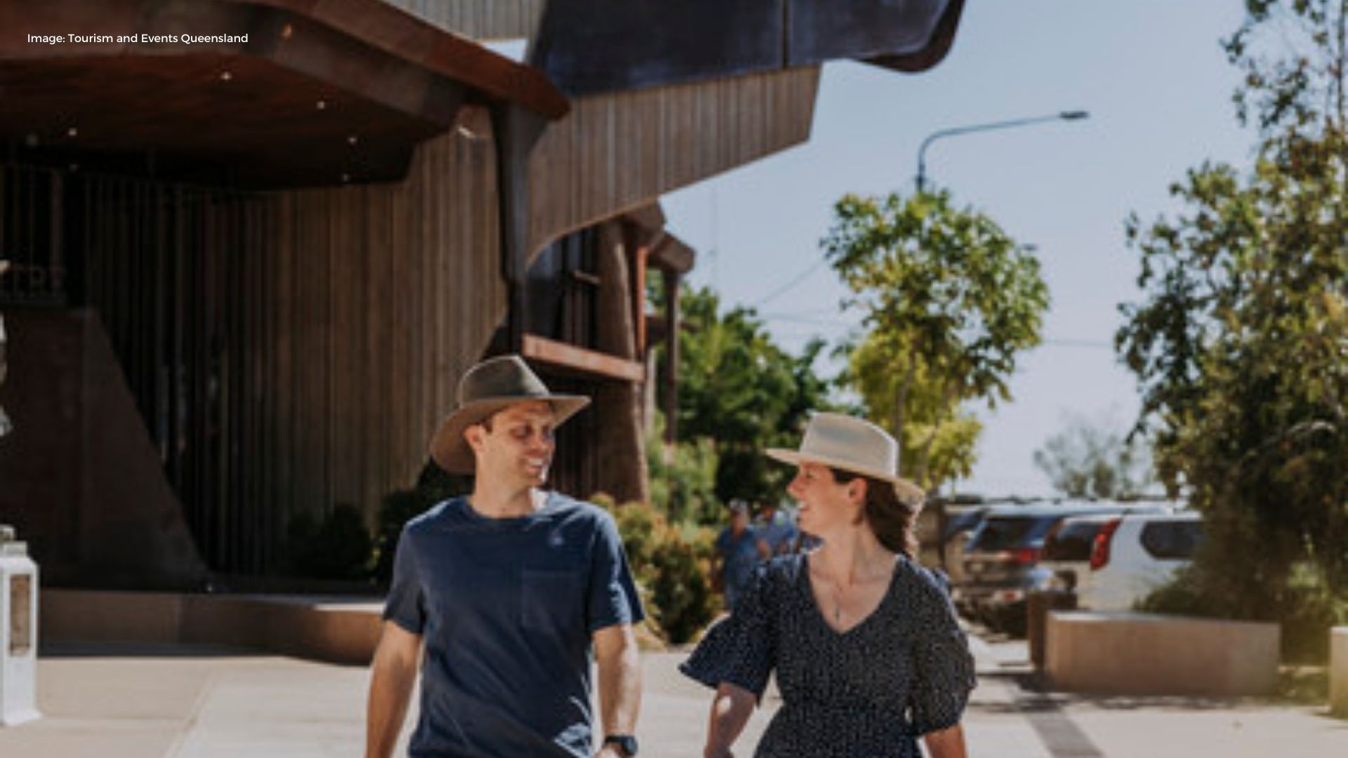 Couple walking away from Waltzing Matilda Centre | Tourism & Events Queensland