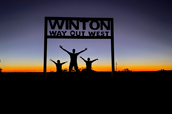 Family in front of Winton sign